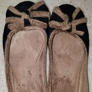 Black faux suede ballet flats with bows